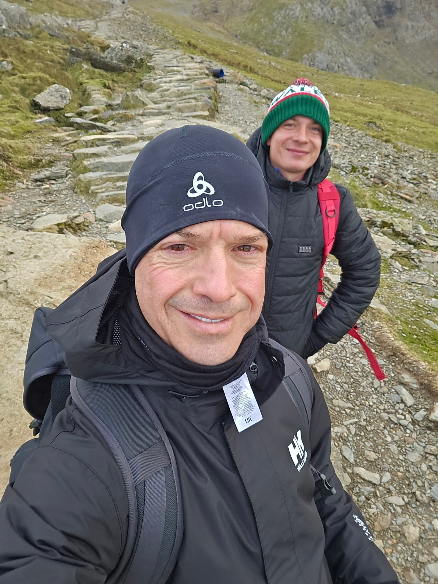 Two Faculty participants hiking together on a mountain path